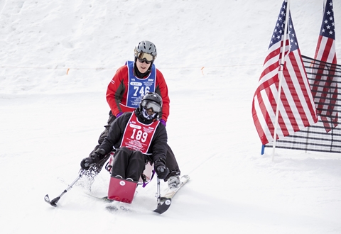 A Veteran taking part in adaptive skiing
