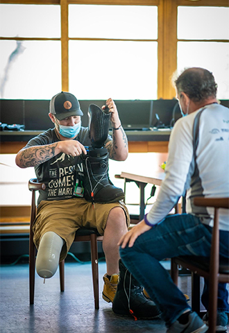 Ryan Garza attends a fit clinic with his new snowboarding prothesis
