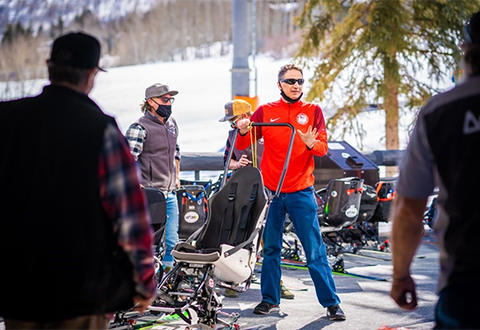 A ski program director talks with staff and volunteers